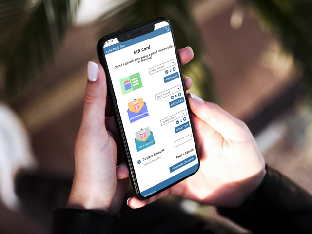 Person on phone to buy gift card with membership software