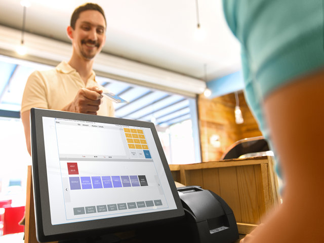 Customer checking out at retail POS system